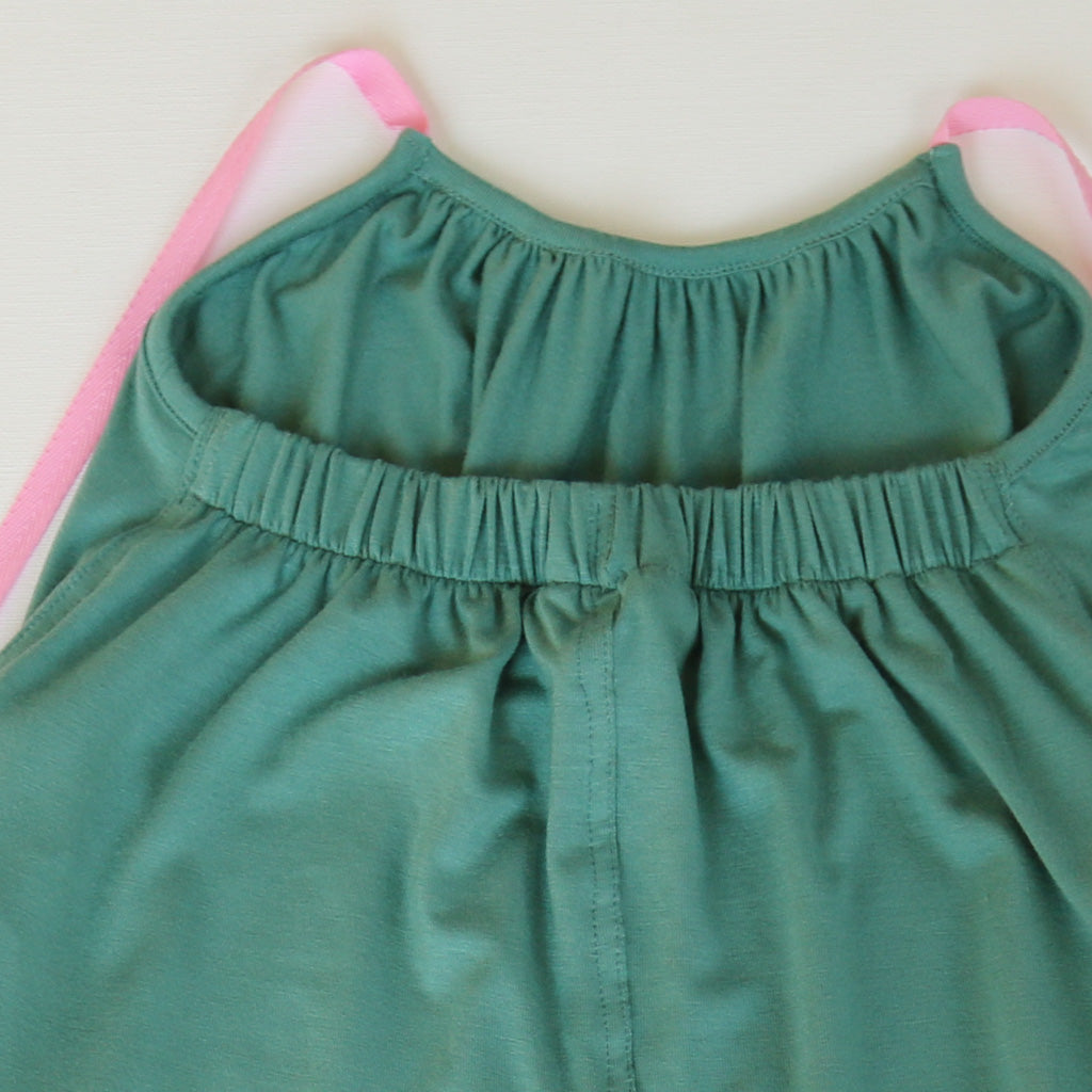 A Jade Green Halter Neck romper by Hiccups & Buttercups