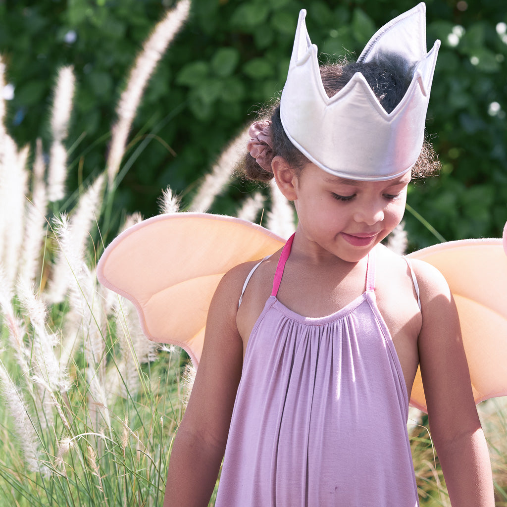 girl wearing silver dress up crown 