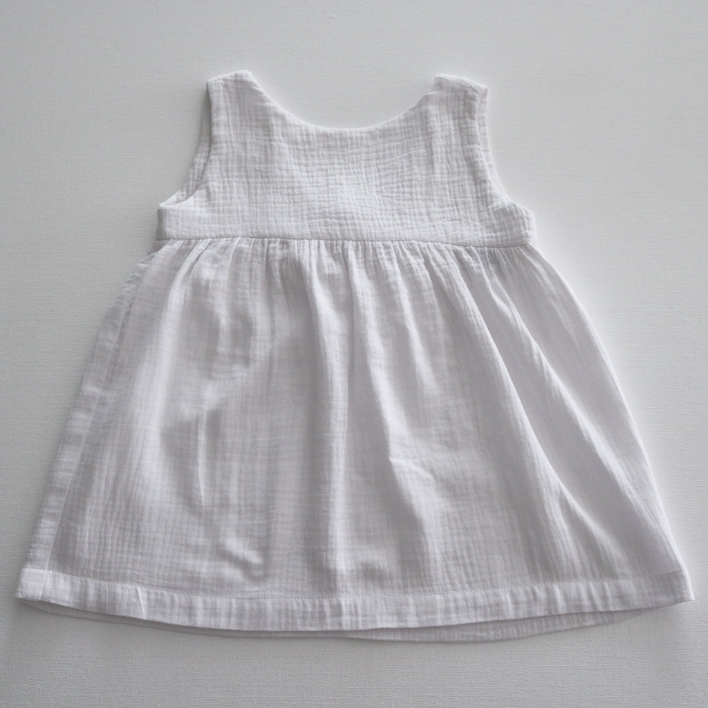 A white summer dress in organic cotton by Hiccups and Buttercups